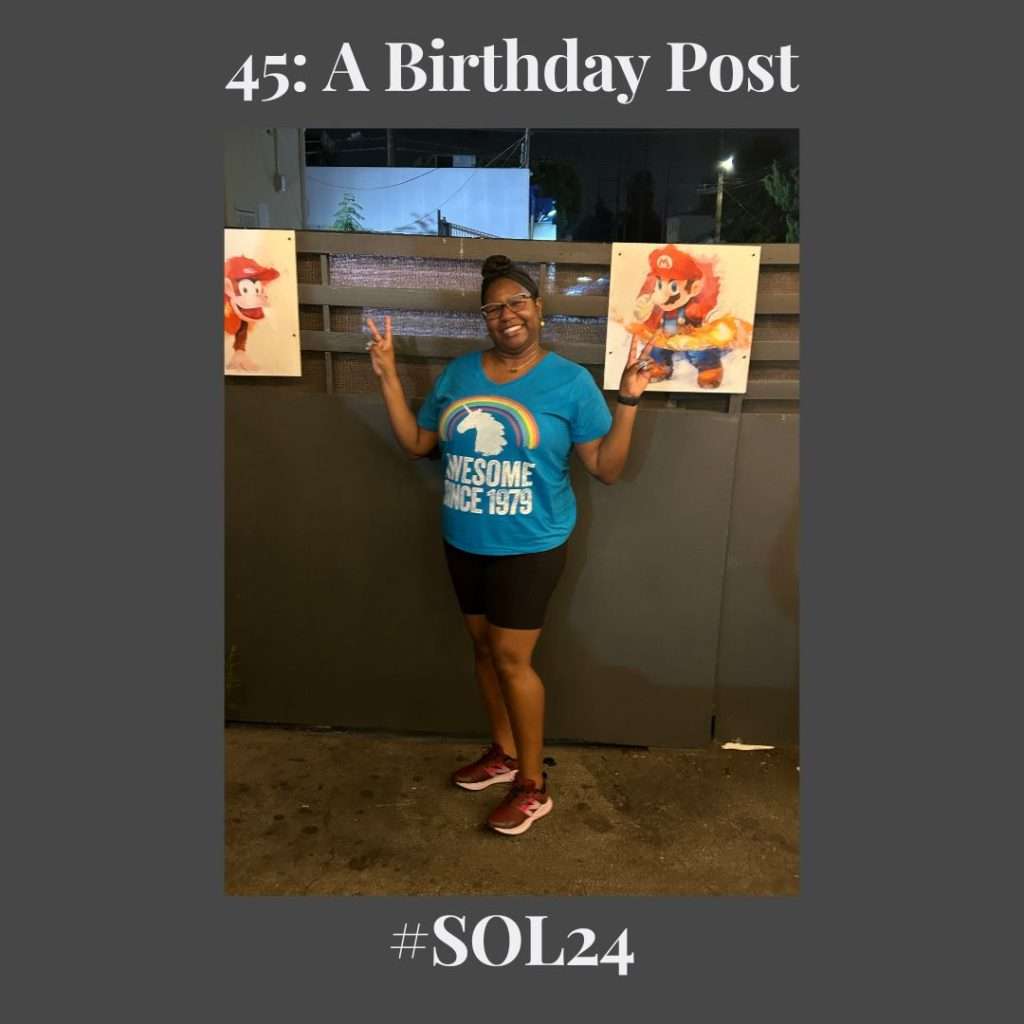 a picture of me wearing a blues shirt with the text "awesome since 1979" in white along with the picture of a unicorn head and a rainbow